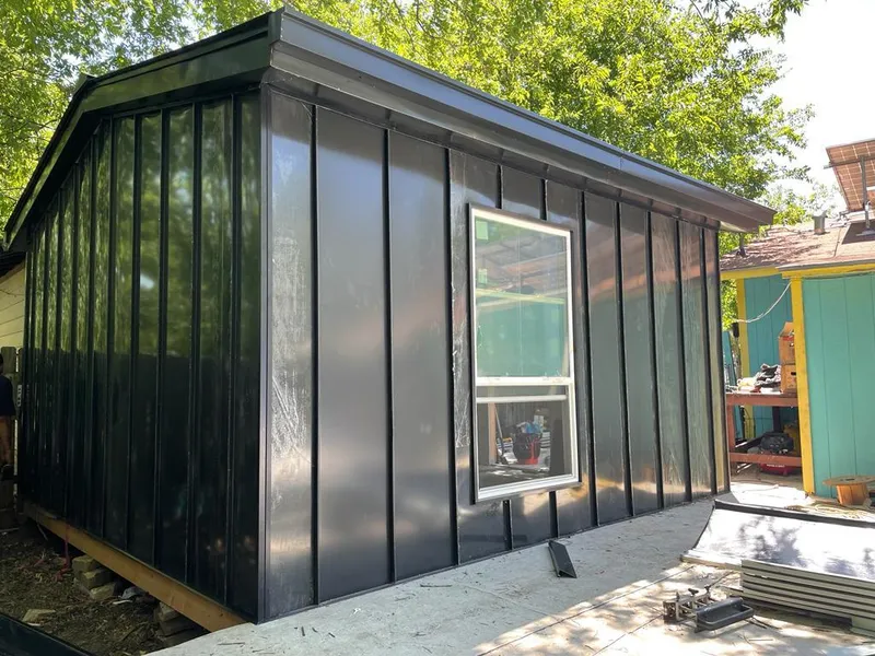 Black standing seam metal wall panels for Roof Inspection in Coon Rapids