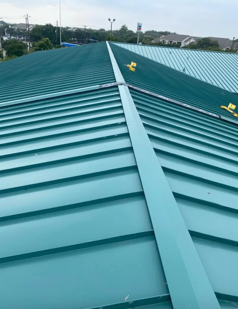 Green commercial metal roof ridge and valley for Metal Roof Repair in Coon Rapids