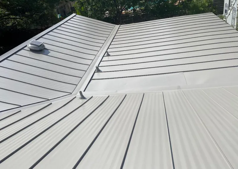 Solar attic fan installed on a metal roof for Roof Ventilation in Coon Rapids